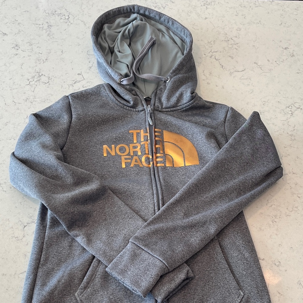 The North Face Gray Jacket with Metallic Gold Logo